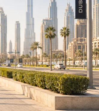 Downtown Dubai boulevard with the Burj Khalifa and a DUBAI street sign